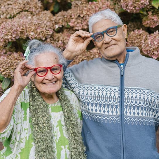 Elderly couple wearing stylish glasses, showcasing Dresden Vision Australia's comfortable, durable, and affordable Australian-made eyewear designed for seniors.
